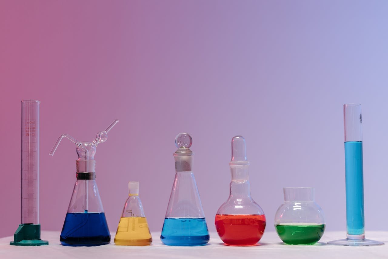 Vibrant glassware filled with colorful liquids in a laboratory setting.
